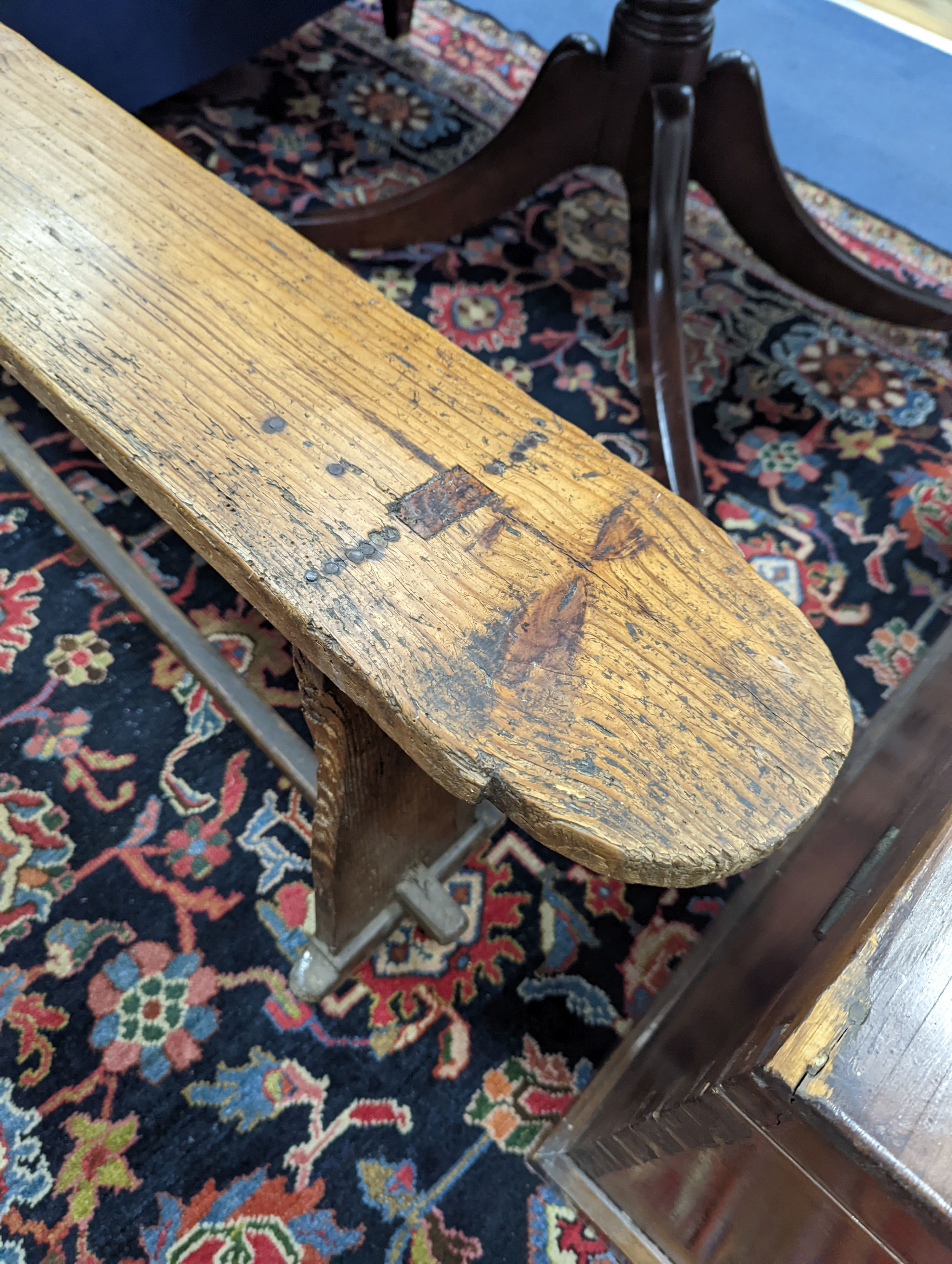 An 18th century pine bench, length 162cm, height 49cm